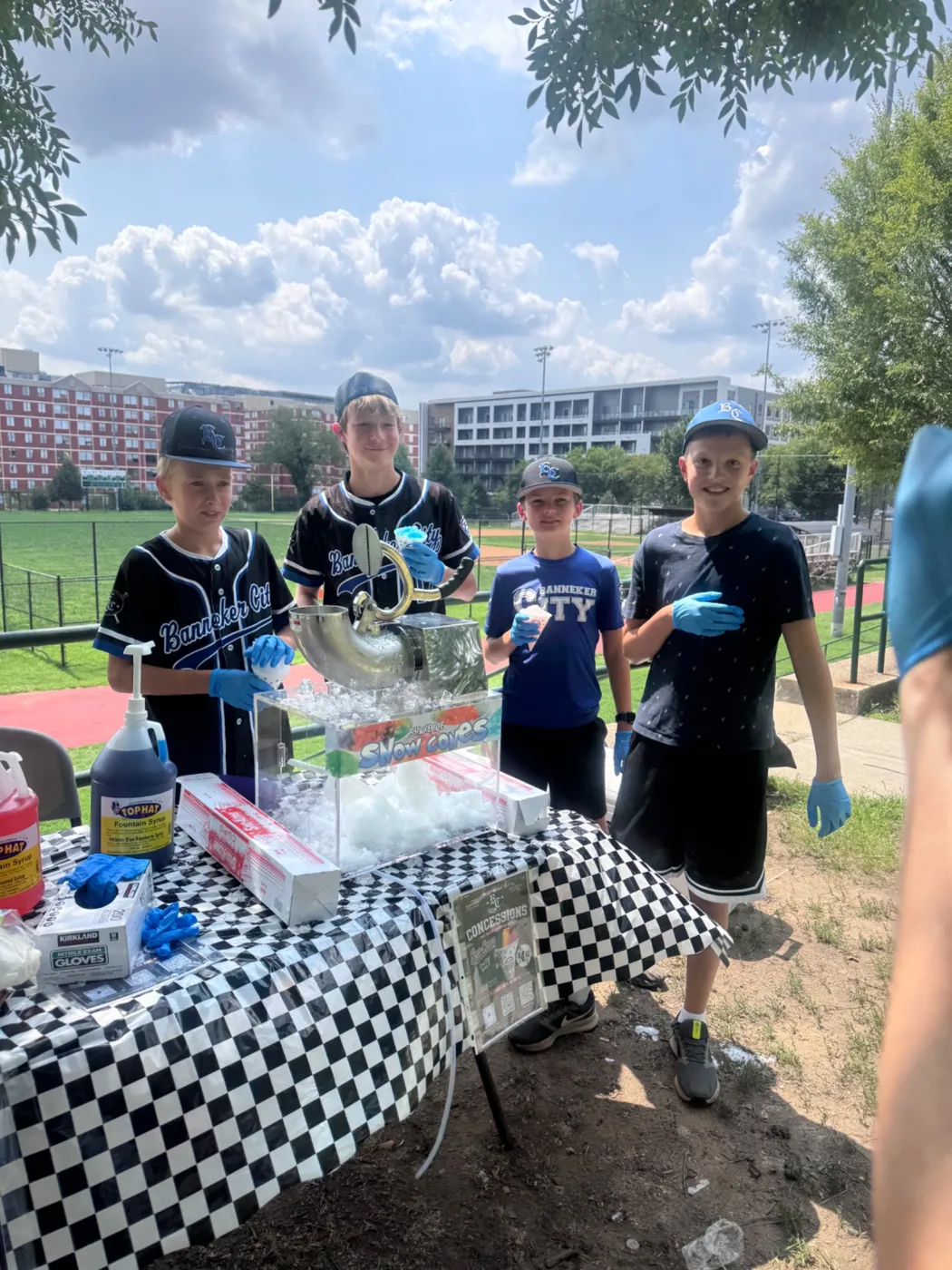 Youth volunteers running a snow cone concession stand
